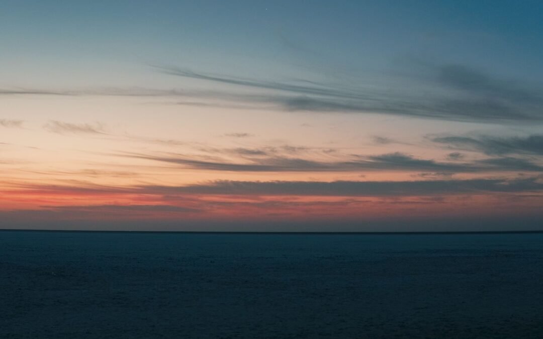Breathtaking sunset view over the Rann of Kutch, capturing the tranquil dusk sky.