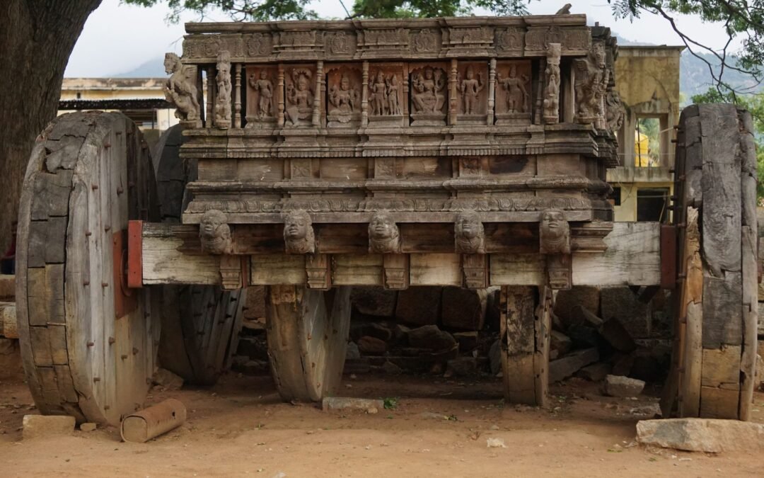 Intricate ancient stone chariot located in Hampi, India, showcasing remarkable architectural details.